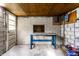 Spacious workshop with a workbench and concrete block walls at 1733 N Spencer Ave, Indianapolis, IN 46218