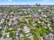 An aerial view showcases a neighborhood with mature trees and downtown skyline at 1917 Fletcher Ave, Indianapolis, IN 46203