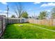 Expansive backyard featuring green grass, a fire pit, and a shed, creating a perfect outdoor oasis at 1917 Fletcher Ave, Indianapolis, IN 46203