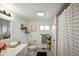 Bright bathroom with modern fixtures, including a vanity and decorative black and white flooring at 1917 Fletcher Ave, Indianapolis, IN 46203