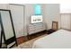 Bright bedroom featuring a modern dresser, accent mirror, and stylish decor for comfortable living at 1917 Fletcher Ave, Indianapolis, IN 46203