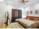 Cozy bedroom with a ceiling fan, decorative artwork and plush rug at 1917 Fletcher Ave, Indianapolis, IN 46203