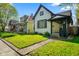 Charming two-story home with a well-maintained lawn and inviting front porch at 1917 Fletcher Ave, Indianapolis, IN 46203