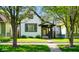 Charming two-story home with a well-maintained lawn and inviting front porch at 1917 Fletcher Ave, Indianapolis, IN 46203