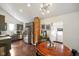 Charming kitchen with stainless steel appliances, brick column, and hardwood flooring at 1917 Fletcher Ave, Indianapolis, IN 46203