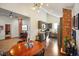 Open-concept kitchen with stainless steel appliances, gray cabinets, and brick column detail at 1917 Fletcher Ave, Indianapolis, IN 46203