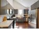 Bright kitchen with modern stainless steel appliances and stylish gray cabinets at 1917 Fletcher Ave, Indianapolis, IN 46203