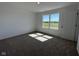 Bedroom featuring neutral carpeting, a window for natural light, and ample space at 196 Aster Way, Greenfield, IN 46140