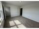 Empty bedroom featuring neutral carpet, a window, and a closet with a door ajar at 196 Aster Way, Greenfield, IN 46140