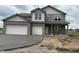 Charming two-story home with a two car garage, set on a spacious lot at 196 Aster Way, Greenfield, IN 46140