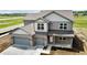 Beautiful two-story home featuring a two car garage and covered entry at 196 Aster Way, Greenfield, IN 46140