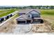 New two-story home featuring an attached garage and covered front porch in a suburban neighborhood at 196 Aster Way, Greenfield, IN 46140