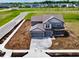 Newly constructed two-story home featuring attached garage in a developing community at 196 Aster Way, Greenfield, IN 46140