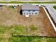 Aerial view of a two-story home with gray siding and a spacious yard ready for landscaping at 196 Aster Way, Greenfield, IN 46140