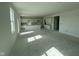 Spacious kitchen features white cabinets and an island at 196 Aster Way, Greenfield, IN 46140