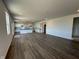 Bright, open-concept living room featuring modern flooring and recessed lighting at 196 Aster Way, Greenfield, IN 46140