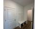 Entryway mudroom with a built-in bench and convenient storage hooks at 196 Aster Way, Greenfield, IN 46140