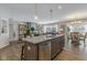 Bright, open kitchen with island seating, stainless steel dishwasher, and granite countertops at 19600 Atwater Ave, Sheridan, IN 46069