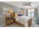 Comfortable main bedroom showcasing a bed with wooden frame and an accent wall with geometric pattern at 19600 Atwater Ave, Sheridan, IN 46069