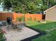 Backyard featuring a brick patio, an outdoor dining set, and a built-in fire pit at 2001 Hoyt Ave, Indianapolis, IN 46203