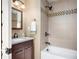 Cozy bathroom featuring a shower-tub combination and a granite countertop sink at 2001 Hoyt Ave, Indianapolis, IN 46203