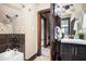Renovated bathroom featuring a shower-tub combination and a modern sink area at 2001 Hoyt Ave, Indianapolis, IN 46203