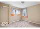 Neutral bedroom with carpet flooring and bright, natural light shining through the windows at 2001 Hoyt Ave, Indianapolis, IN 46203