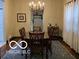 Bright dining room featuring a chandelier, table with seating and natural light at 2001 Hoyt Ave, Indianapolis, IN 46203