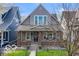 Charming two-story home with inviting front porch and well-maintained lawn at 2001 Hoyt Ave, Indianapolis, IN 46203