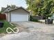 View of the detached two car garage with an exterior parking area at 2001 Hoyt Ave, Indianapolis, IN 46203