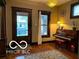 Cozy living room featuring hardwood floors, bright windows and comfortable ambiance at 2001 Hoyt Ave, Indianapolis, IN 46203