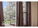 A beautiful view of a flowering tree from inside the house, creating a serene atmosphere at 2001 Hoyt Ave, Indianapolis, IN 46203