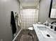 Stylish bathroom featuring marble countertops, matte black fixtures, and a shower with a modern curtain at 210 Prairie Pkwy, Brownsburg, IN 46112