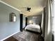 Bedroom featuring natural light, decorative mirror and ceiling fan at 210 Prairie Pkwy, Brownsburg, IN 46112