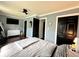 Bedroom with hardwood floors, dresser and ceiling fan at 210 Prairie Pkwy, Brownsburg, IN 46112
