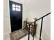Bright entryway featuring a console table, modern decor, and a black front door at 210 Prairie Pkwy, Brownsburg, IN 46112