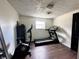 Home exercise room featuring exercise equipment, neutral walls, and a window at 210 Prairie Pkwy, Brownsburg, IN 46112