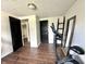Home exercise room featuring exercise equipment, neutral walls, and dark doors at 210 Prairie Pkwy, Brownsburg, IN 46112