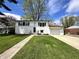 Charming two-story home with a well-maintained lawn, attached garage, and beautiful landscaping at 210 Prairie Pkwy, Brownsburg, IN 46112