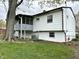 Rear exterior view of the home with a screened porch, siding, and basement level windows at 210 Prairie Pkwy, Brownsburg, IN 46112