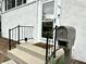 Close-up showcasing the home's front entrance with a charming mailbox, railing, and inviting steps at 210 Prairie Pkwy, Brownsburg, IN 46112