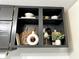 Nicely staged kitchen shelves with decorative bowls, vases, cutting boards, and lush greenery at 210 Prairie Pkwy, Brownsburg, IN 46112