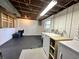 Basement laundry area featuring a utility sink, washer, dryer and some storage shelving at 210 Prairie Pkwy, Brownsburg, IN 46112