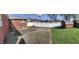 Well-maintained backyard features storage shed, patio, basketball hoop and white fence at 2141 N Cole St, Indianapolis, IN 46224