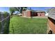 Spacious backyard features a chain link fence and green lawn at 2141 N Cole St, Indianapolis, IN 46224
