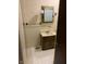 Bathroom features patterned tile flooring, vanity with ample storage and decor mirror at 2141 N Cole St, Indianapolis, IN 46224