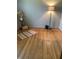 Bedroom with hardwood floors, gray walls, neutral decor, and an decorative glass lamp at 2141 N Cole St, Indianapolis, IN 46224