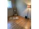 Bedroom with hardwood floors, gray walls, neutral decor, and an decorative glass lamp at 2141 N Cole St, Indianapolis, IN 46224