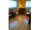 Bedroom with wood floors, yellow walls, and natural light at 2141 N Cole St, Indianapolis, IN 46224