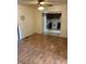 Open floor plan with wood floors that leads to a kitchen with white appliances at 2141 N Cole St, Indianapolis, IN 46224